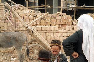 44 Kashgar Sunday Market 1993 Man Repairing Shoes.jpg